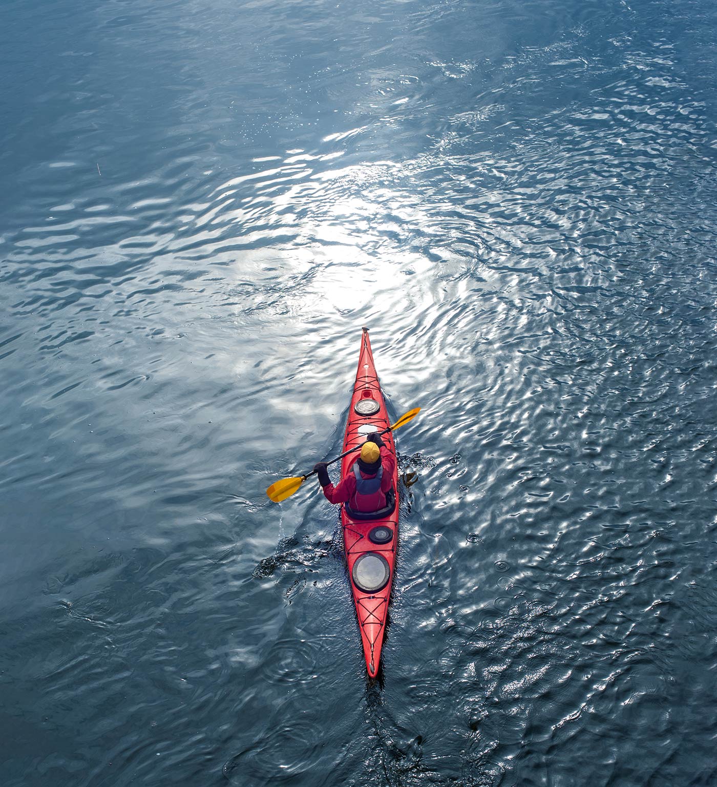 Top down view of man kayaking on the Anacostia River